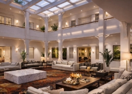 Grand salon de réception privé VVIP à Doha organisé autour d’un vaste atrium lumineux, avec mobilier haut de gamme et architecture élégante sur plusieurs niveaux.