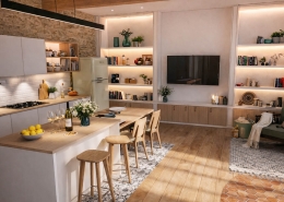 Cuisine ouverte rénovée dans une maison en pierre près de Belvès en Dordogne, avec îlot central en bois clair, éclairage chaleureux et séjour contemporain.