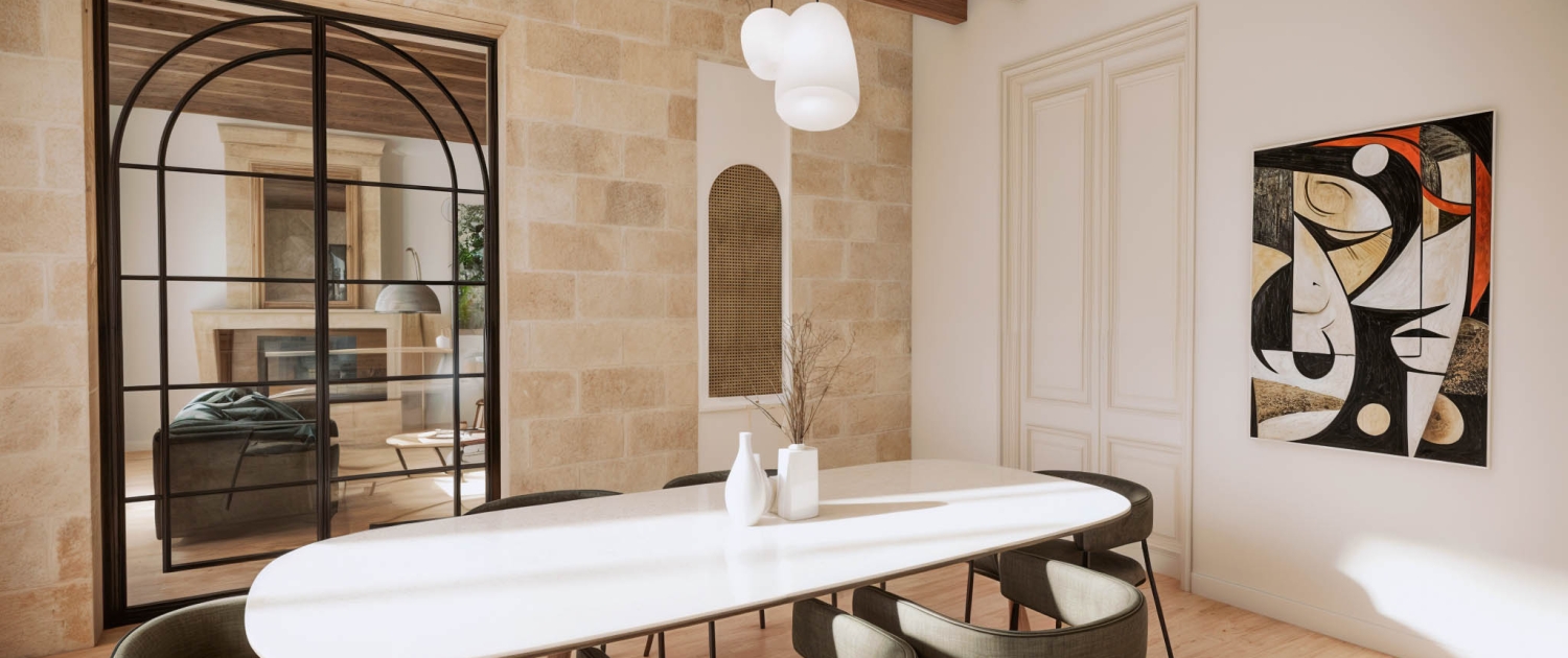 Salle à manger entre tradition et modernité Salle à manger rénovée avec murs en pierre apparente, porte vitrée contemporaine et mobilier élégant conçu par un architecte d’intérieur